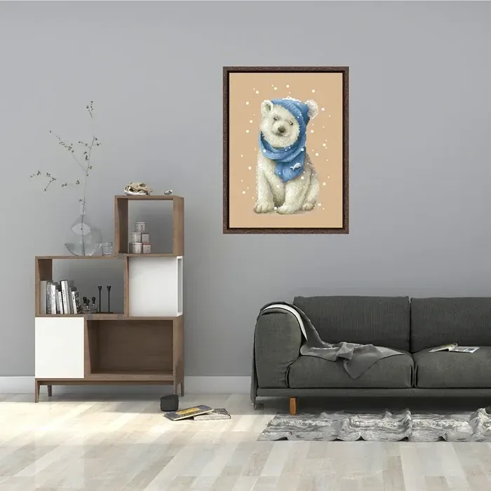 Framed White Bear design DPD271 hanging on a gray living-room wall above a dark couch and a bookshelf