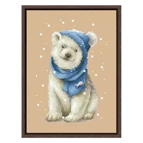 White Bear counted cross stitch design DPD271: a polar bear cub sitting in a denim-blue beanie and scarf decorated with a small fish