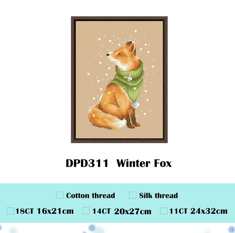 Winter Fox counted cross stitch design DPD311: a red fox in a green knit snood sitting in falling snow, shown framed with its three size options