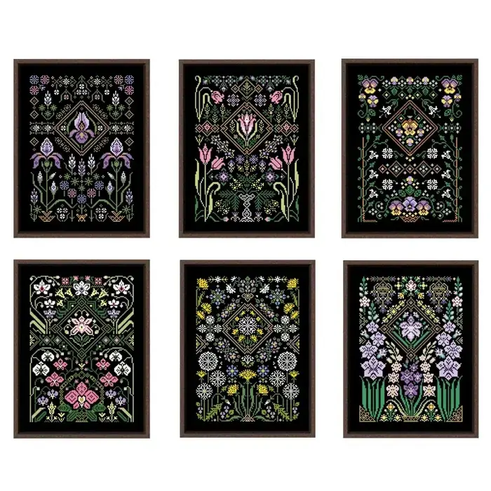 All six black-canvas floral sampler designs shown framed: Iris, Tulip, Pansy, Orchid, Dandelion and Gladioli