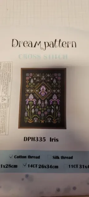 Buyer photo of the Iris black-canvas kit: the Dream pattern pouch with the DPH335 iris sampler design, black fabric and chart